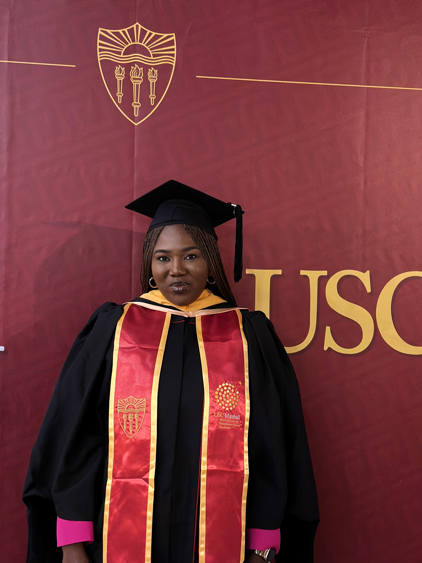 Oluseun Adesanya in cap and gown at USC commencement